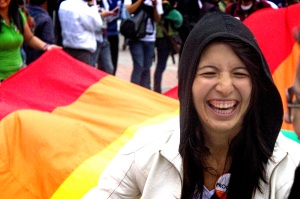 A woman smiles at Bogotá Gay Pride 2012